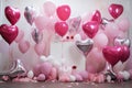 many heart heart foil balloons surrounding pink confetti