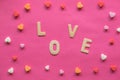 Many hearts with word LOVE on pink background, Love icon, valentine`s day, relationships concept