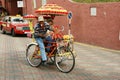 A decorated trishaw or tricycle rickshaw in historical Malacca or Melaka, Malaysia