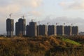 Many high-rise buildings under construction in the fields in the sunset near Shanghai Royalty Free Stock Photo