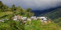 Many houses on the hill at sunset