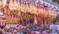 Many Iberian hams at the meat market