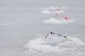 Many of ice fishinng rods on the pond