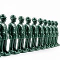 Many identical toy green soldiers in a row on a white background, the concept of militarization, army, weapons Royalty Free Stock Photo