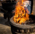 Many incense sticks are in flames on the stone pot at Jaya Sri Maha Bodhi Anuradhapura, incense sticks are on the fire. the