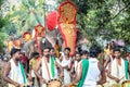 Many indian drummers play national drums walking by indian village on annual festival