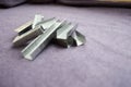 Many iron, metal, silvery construction staples Royalty Free Stock Photo