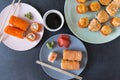 Many Japanese rolls with caviar and salmon on a plate, cold Japanese rolls, baked hot rolls, top view, California rolls, Royalty Free Stock Photo