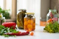 many jars with pickled vegetables mix inside, preparation for winter seasons Royalty Free Stock Photo