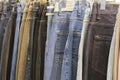 Many jeans hanging on arack. Row of pants denim jeans hanging in closet, concept of buy , sell , shopping and jeans fashion