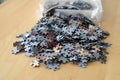 Jigsaw puzzle pieces out of the plastic bag Royalty Free Stock Photo