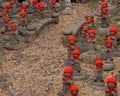 Many jizo with red hat