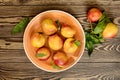 Many juicy beautiful amazing nice peaches on dark wooden background.