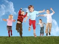 Many jumping children on grass, collage Royalty Free Stock Photo