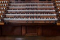 Many keys on a big old brown church organ Royalty Free Stock Photo