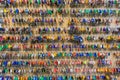 Many keys with colorful plastic key tags hanging on hooks on the wooden board.