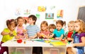 Many kids drawing and gluing Royalty Free Stock Photo