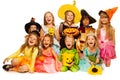 Many kids sit in group wearing Halloween costumes Royalty Free Stock Photo