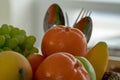 Many kinds of fruit piles with a spoon and fork in the back Royalty Free Stock Photo