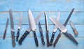 Set of kitchen knifes, flat lay on rustic table