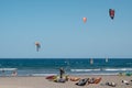 Many kite board surfer and wind surfer on ocean El Medano beach