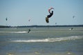 Many Kite board surfers on ocean