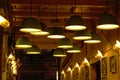 Many lamps on the ceiling and wall of a small covered street in Rijeka, Croatia