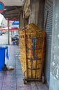 Many large baskets are stacked on Hand Trolley With 2 Solids Wheels on a footpath in Bangkok, Thailand