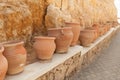 Many large clay pots standing in a row Royalty Free Stock Photo