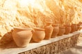Many large clay pots standing in a row Royalty Free Stock Photo