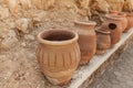 Many large clay pots standing in a row Royalty Free Stock Photo