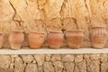 Many large clay pots standing in a row Royalty Free Stock Photo