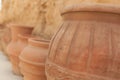 Many large clay pots standing in a row Royalty Free Stock Photo