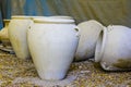 Large clay pots standing in a row in the open air Royalty Free Stock Photo