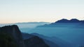 Many layer of fog cover the moutain in the morning.