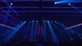 Many lighting devices on the empty stage of the concert hall. Stock footage. Blue and purple shimmering light strobes Royalty Free Stock Photo