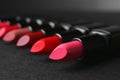 Many lipsticks on dark Royalty Free Stock Photo