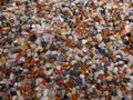 Many little colorful stones. Colorful mix of polished gemstones and minerals. Close-up