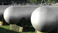 many long giant gas pressure vessels for the storage of flammable natural gas Royalty Free Stock Photo