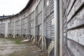 Many long Old abandoned warehouses against the gray sk