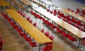 many long table with chairs in a wide lunch room Royalty Free Stock Photo