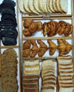 Many many breads lay on the table for breakfast.