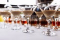 Many martini glasses with alcohol cream coffee irish cocktail, on white table background. Irish cream baileys liqueur Royalty Free Stock Photo