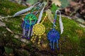 Many metal bookmark with dreamcatcher handmade on the bark tree