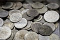 Many metal coins of different denominations and different countries close up Royalty Free Stock Photo