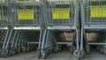 Many metal shopping carts on a parking lot near supermarket outdoors. Shopping concept. Shopping carts outside Royalty Free Stock Photo