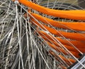 many metallic spokes of orange bicycle Royalty Free Stock Photo
