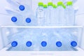 Many mineral fresh drinking water in plastic bottle freeze in cooler shelf or refrigerator for cool water for person who want to Royalty Free Stock Photo