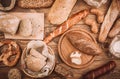 Many mixed baked breads and rolls on rustic wooden table Royalty Free Stock Photo