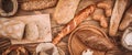 Many mixed baked breads and rolls on rustic wooden table Royalty Free Stock Photo